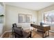 Bright home office with wood desk and leather chairs at 3003 Timberchase Trl, Highlands Ranch, CO 80126