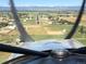 Aerial view captures the property with a clear runway, featuring scenic mountain views in the background at 4627 Cathy Ln, Erie, CO 80516