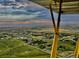 Breathtaking aerial view featuring a patchwork of agricultural fields and distant mountains at 4627 Cathy Ln, Erie, CO 80516