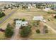 Expansive aerial view captures a home, a barn, and outbuildings on a large lot at 4627 Cathy Ln, Erie, CO 80516