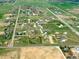 Aerial view of a residential community in a rural setting, featuring spacious lots and green fields at 4627 Cathy Ln, Erie, CO 80516