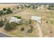 Expansive aerial view of property featuring a home and a large hangar at 4627 Cathy Ln, Erie, CO 80516