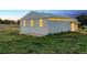 Exterior shot of large metal barn with light filtering through windows during daytime at 4627 Cathy Ln, Erie, CO 80516