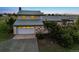 Charming home featuring a two-car garage, lush landscaping, and inviting front entryway at 4627 Cathy Ln, Erie, CO 80516