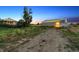 View of property highlighting a barn and residence on a large lot, showcasing rural living at 4627 Cathy Ln, Erie, CO 80516