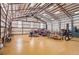 Spacious garage featuring high ceilings and a car lift with ample room for vehicles and projects at 4627 Cathy Ln, Erie, CO 80516