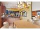 Cozy kitchen and dining area featuring natural wood elements and stylish lighting at 4627 Cathy Ln, Erie, CO 80516