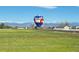 Scenic shot of a hot air balloon launch, framed by distant snow-capped mountains at 4627 Cathy Ln, Erie, CO 80516