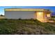 Wide shot of the outbuilding featuring ample parking and a garage door at 4627 Cathy Ln, Erie, CO 80516