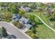 An aerial view of the property with lush green surroundings, walkways, and mature trees at 902 Grove Dr, Louisville, CO 80027