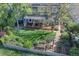 Lovely aerial view showcasing a lush backyard with a garden, wooden pergola, and a charming home at 902 Grove Dr, Louisville, CO 80027