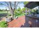 Beautiful backyard features a wood deck with a dining table and a landscaped yard at 902 Grove Dr, Louisville, CO 80027
