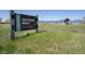 Sign for Davidson Mesa City of Louisville with an open grassy area, shelter, and mountain views at 902 Grove Dr, Louisville, CO 80027