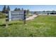 Sign for Harper Lake City of Louisville featuring an open grassy area, a trail and a view of the lake at 902 Grove Dr, Louisville, CO 80027