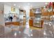 Large kitchen with stainless steel appliances, wooden cabinetry, and spacious granite countertops at 902 Grove Dr, Louisville, CO 80027
