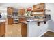 Spacious kitchen with stainless steel appliances, granite countertops and breakfast bar at 902 Grove Dr, Louisville, CO 80027