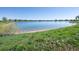 Scenic view of a serene lake with lush green shoreline and clear blue sky at 902 Grove Dr, Louisville, CO 80027