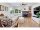 Cozy living room with a large sectional sofa, fireplace, and hardwood floors at 902 Grove Dr, Louisville, CO 80027
