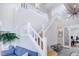 Open living area with high ceilings, a staircase, and bright natural light at 902 Grove Dr, Louisville, CO 80027