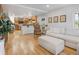 Bright living room with hardwood floors that connect to the kitchen, and a comfortable sitting area at 902 Grove Dr, Louisville, CO 80027