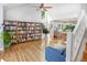Bright living room with built-in bookshelves, hardwood floors, and lots of natural light at 902 Grove Dr, Louisville, CO 80027