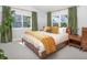 Serene main bedroom with large windows offering backyard views and a king-sized bed at 902 Grove Dr, Louisville, CO 80027