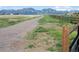 Picturesque walking path with mountain views and adjacent wood fence creating a serene outdoor experience at 902 Grove Dr, Louisville, CO 80027