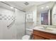 Bathroom featuring a glass shower and single vanity at 10311 E Evans Ave # 133, Aurora, CO 80247