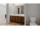 Bathroom featuring wood vanity and updated fixtures at 10311 E Evans Ave # 133, Aurora, CO 80247