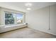 Cozy bedroom featuring a window seat and neutral carpeting; ideal for relaxation with a view at 10311 E Evans Ave # 133, Aurora, CO 80247