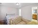 Bedroom featuring carpet and bathroom access at 10311 E Evans Ave # 133, Aurora, CO 80247