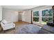 Bright living room with wood floors and multiple windows allowing natural light at 10311 E Evans Ave # 133, Aurora, CO 80247