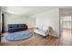 Spacious living room with wood floors, and an open kitchen layout at 10311 E Evans Ave # 133, Aurora, CO 80247