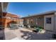 Private patio featuring decorative flower pots, outdoor dining set, and partial pergola at 10311 E Evans Ave # 133, Aurora, CO 80247