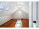Bright attic space featuring a yoga mat, natural light from the window, and unique architecture at 1429 Josephine St, Denver, CO 80206