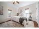 Bright bedroom features an area rug, neutral walls, and two windows providing an airy ambiance at 1429 Josephine St, Denver, CO 80206