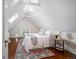 Bright bedroom with a vaulted ceiling, dormer window, and comfortable bed with stylish accents at 1429 Josephine St, Denver, CO 80206