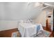 Bedroom with bright white interior, vaulted ceiling, stylish bed, and access to another room at 1429 Josephine St, Denver, CO 80206