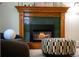 Living room fireplace with striking wooden mantle and patterned ottoman adds warmth and character at 1429 Josephine St, Denver, CO 80206