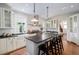 Bright kitchen with white cabinets, a stainless steel range hood, and updated fixtures at 1429 Josephine St, Denver, CO 80206