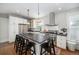Stylish kitchen featuring a center island with seating, stainless steel appliances, and ample counter space at 1429 Josephine St, Denver, CO 80206
