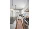 Modern kitchen with stainless steel appliances, ample storage, and a spacious layout at 1429 Josephine St, Denver, CO 80206