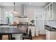 Well-appointed kitchen with stainless steel appliances, subway tile backsplash, and natural light at 1429 Josephine St, Denver, CO 80206