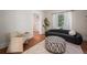 Bright living room featuring hardwood floors, modern furnishings, and natural light from a large window at 1429 Josephine St, Denver, CO 80206