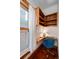 Well-lit office with custom cabinetry, desk, and blue chair at 1429 Josephine St, Denver, CO 80206