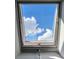 Skylight view framing bright blue skies and fluffy white clouds at 1429 Josephine St, Denver, CO 80206