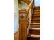 Traditional wooden staircase with decorative post showcasing craftsmanship and character at 1429 Josephine St, Denver, CO 80206