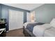 Cozy bedroom with blue walls and closet at 3793 Cadence Dr, Castle Rock, CO 80109
