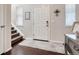 Bright entryway with hardwood floors and staircase at 3793 Cadence Dr, Castle Rock, CO 80109