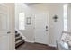 Bright foyer with hardwood floors and staircase at 3793 Cadence Dr, Castle Rock, CO 80109